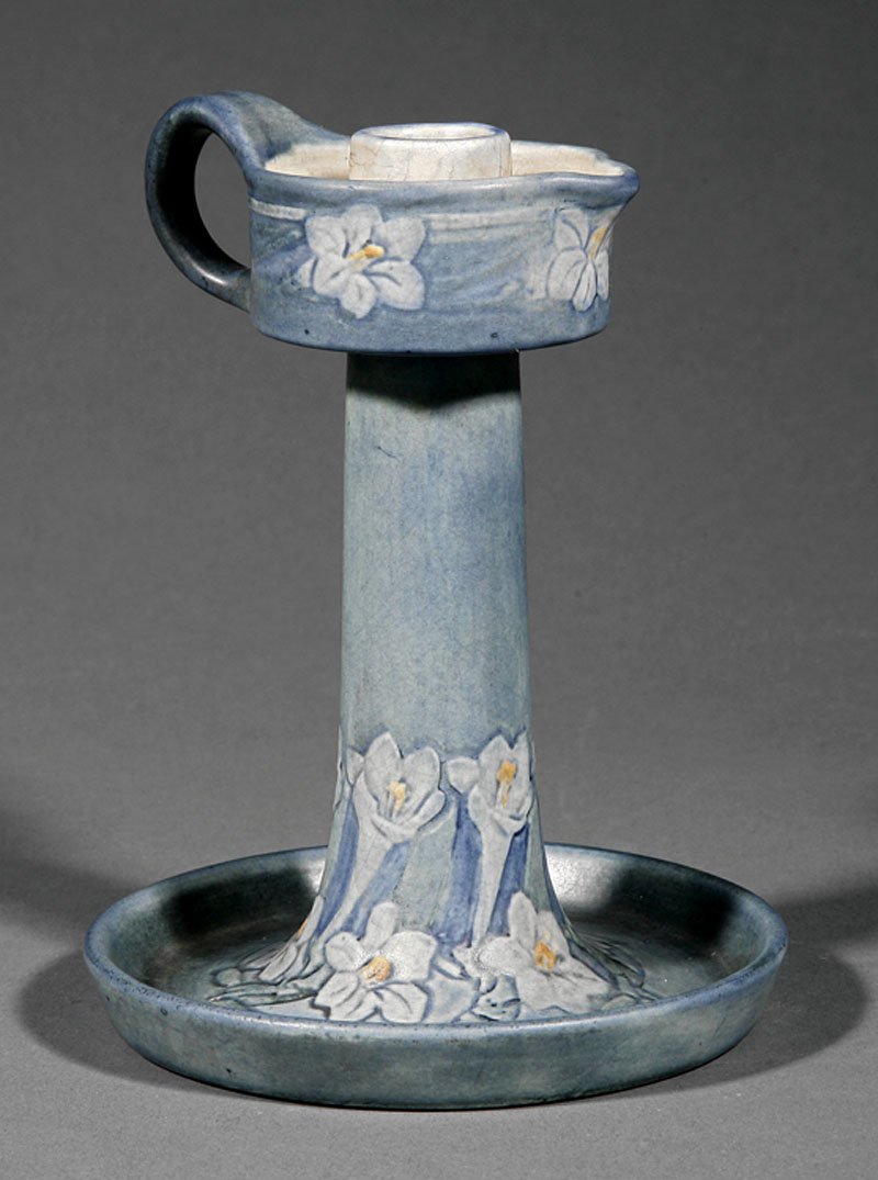 A Newcomb College Art Pottery Chamberstick: A Newcomb College Art Pottery Chamberstick, 1911, decorated by Henrietta Bailey with paperwhite narcissus, semi-matte glaze with blue, green, white and yellow underglaze, base marked with Newcomb ciph