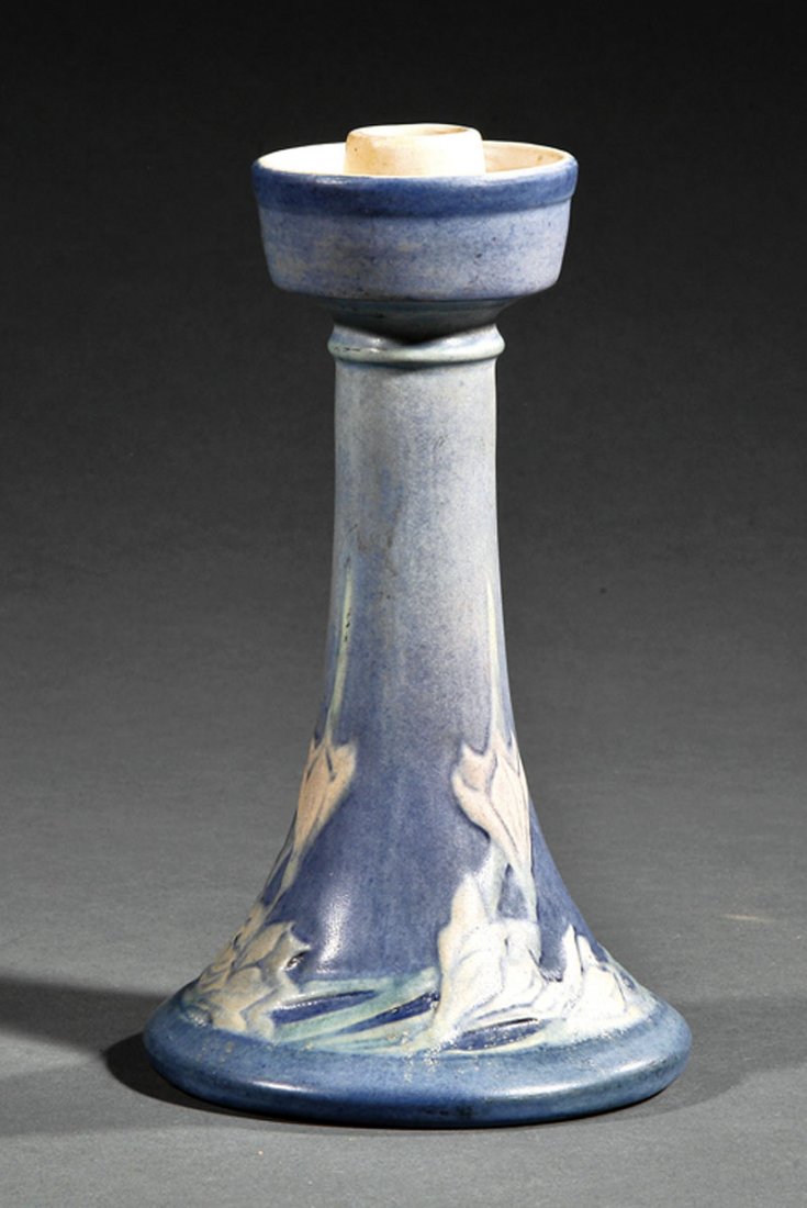 A Newcomb College Art Pottery Candlestick: A Newcomb College Art Pottery Candlestick, 1921, decorated by Anna Frances Simpson with freesia in low relief, matte glaze with blue, green and pink underglaze, base marked with Newcomb cipher, decora