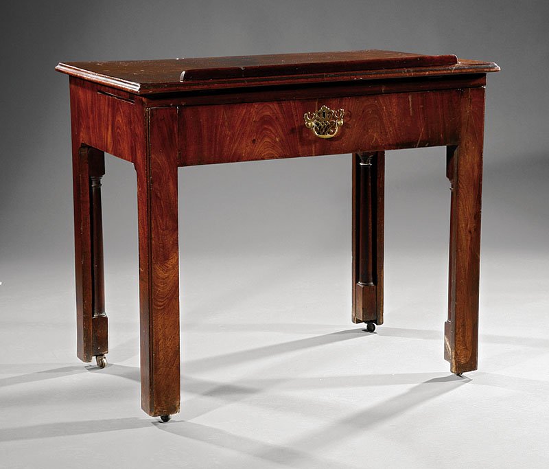 A George III Mahogany Architect's Table: A George III Mahogany Architect's Table, late 18th c., molded hinged top with ratchet mechanism, two candle slides, frieze drawer, square legs, height 30 3/4 in., width 36 in., depth 24 in
