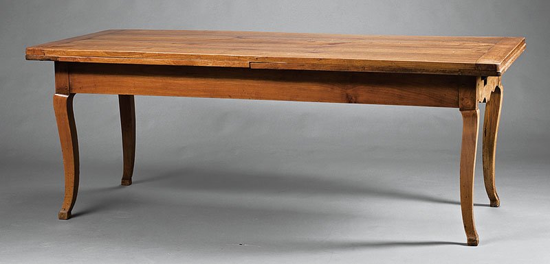 A French Provincial Fruitwood Draw-Leaf Table: A French Provincial Fruitwood Draw-Leaf Table, early 19th c., rectangular top, each end with scroll frieze, cabriole legs, hoof feet, height 29 1/2 in., width 78 in., depth 34 in