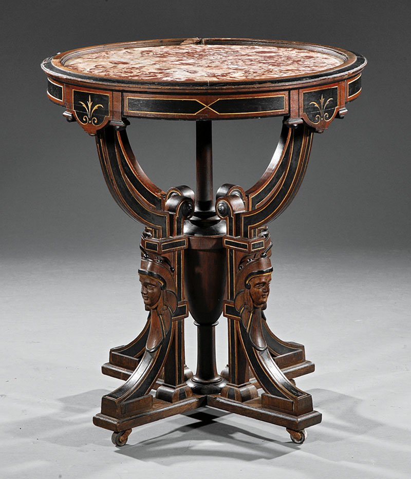 An American Renaissance Gueridon: An American Renaissance Gilt Incised, Ebonized and Carved Walnut Gueridon, late 19th c., molded top with inset marble, paneled frieze, central urn standard, scrolled brackets with masks, molded plinth