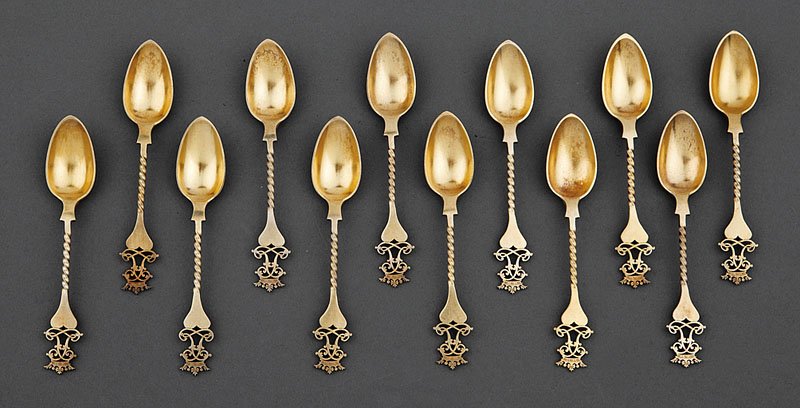 A Set of 12 Victorian Silver Gilt Teaspoons: A Set of 12 Victorian Silver Gilt Teaspoons, maker AH, London, 1875, each handle surmounted by the coronet of a marquess, combined weight 8.30 troy ozs. Provenance: Grace Ballam, LaJolla, CA