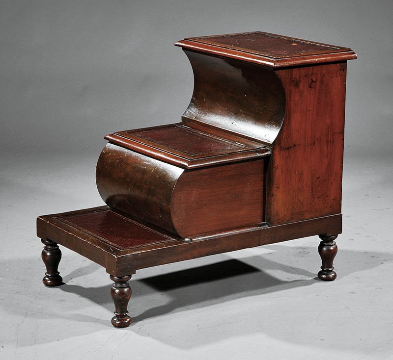 A William IV Mahogany Bedstep: A William IV Mahogany Bedstep, mid-19th c., three inset leather treads, two hinged compartments, turned legs, height 25 in., width 28 in., depth 11 in