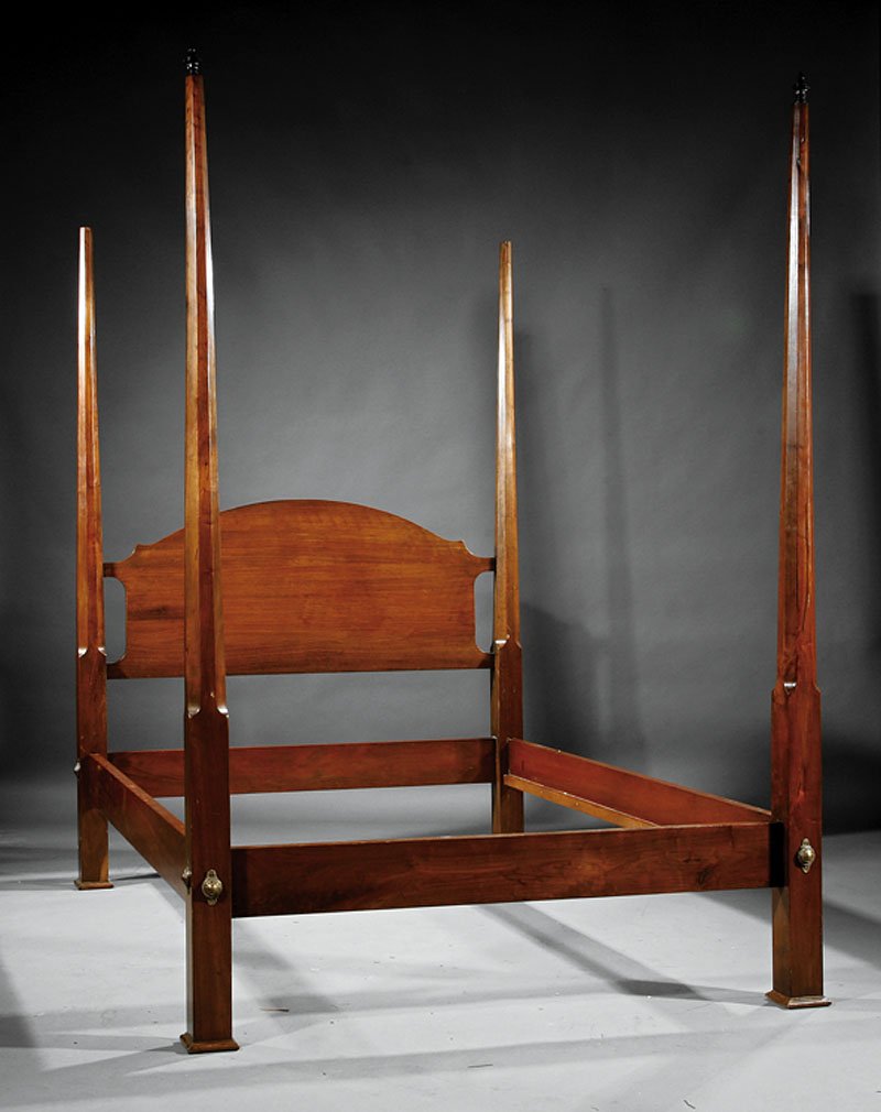 An English Carved Mahogany Four Post Bed: An English Carved Mahogany Four Post Bed, tapered faceted posts, arched headboard, straight foot board, conforming rails, molded feet, height 87 1/2 in., length 77 1/2 in., width 55 in