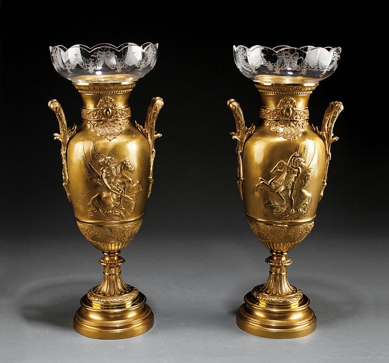 A Pair of French Neoclassical-Style Gilt Bronze U: A Pair of French Neoclassical-Style Gilt Bronze Urns, each of baluster form with relief of Pegasus, ornate cartouche, band of bacchic masks, reeded foliate handles, signed "Leon Boucher", fitted with 
