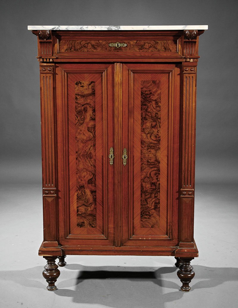 A Continental Carved and Burl Walnut Cabinet: A Continental Carved and Burl Walnut Cabinet, 19th c., marble top, frieze drawer and cupboard doors, shelf interior, fluted stiles, turned feet, height 54 in., width 33 1/2 in., depth 21 in