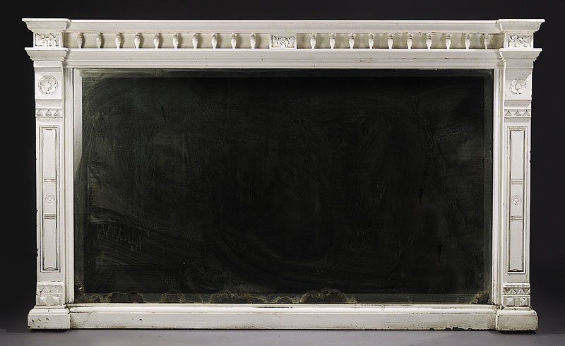 A Large American Eastlake Carved Overmantel Mirro: A Large American Eastlake Carved Overmantel Mirror, later white paint, molded blocked cornice with spindled frieze, paneled stiles carved with quatrefoil, beveled mirror plate, conforming plinth base,