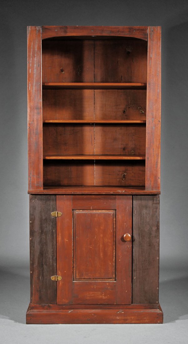 An Stained Pine Cupboard: An Antique Stained Pine Cupboard, flat cornice, shelves over a single raised paneled door, plinth base, height 81 in., width 37 1/2 in., depth 15 in