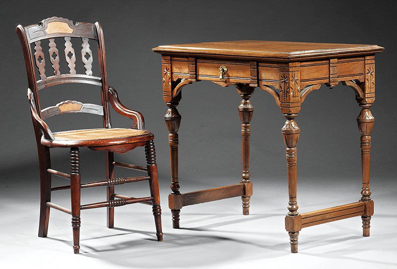 An American Aesthetic Carved Walnut Desk and Chai: An American Aesthetic Carved Walnut Desk and Chair, late 19th c.; desk with molded top above a frieze drawer, incised corners, turned tapered blocked legs, stretchers; chair with pierced splats, circu