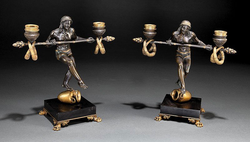 Gilt Patinated-Bronze Figural Candelabra: A Pair of Continental Neoclassical Gilt and Patinated-Bronze Figural Two Light Candelabra, early 19th c., signed "E. Carlier", each with a Classical figure atop an amphora, wreath entwined candle cups