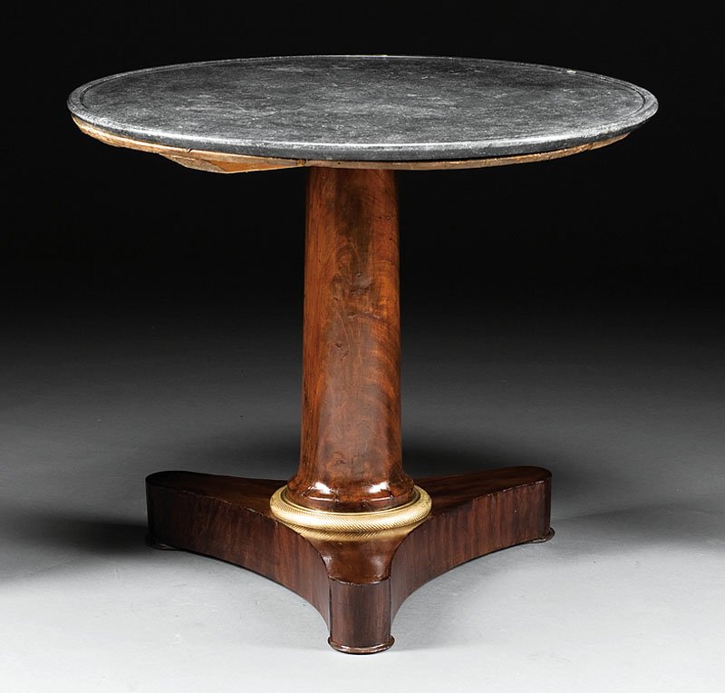 Gilt Bronze-Mounted Mahogany Center Table: A Charles X Gilt Bronze-Mounted Mahogany Center Table, early 19th c., molded marble top, columnar standard with collar, incurvate plinth, disc feet, height 27 in., diameter 32 in