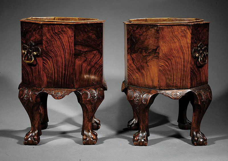 Carved and Figured Walnut Jardinieres: A Pair of George III-Style Carved and Figured Walnut Jardinieres, 19th c., each octagonal body with copper liner, brass bail handles, shaped apron, cabriole legs terminating in ball and claw feet, hei