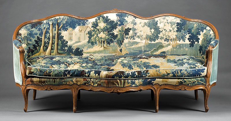 French Provincial Carved Beechwood Canape: A French Provincial Carved Beechwood Canape, 19th c., with antique Flemish tapestry upholstery, loose down cushion, scroll arms, serpentine seat rail, cabriole legs, height 38 in., width 83 in., depth