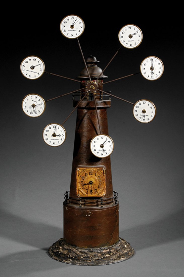 American Tole Lighthouse Automaton Clock: An Antique American Tole Lighthouse Automaton Clock, late 19th c., lighthouse case on rocaille base, inset with master dial, rotating windmill structure mounted with dials marked "Peking", "Madrid", "