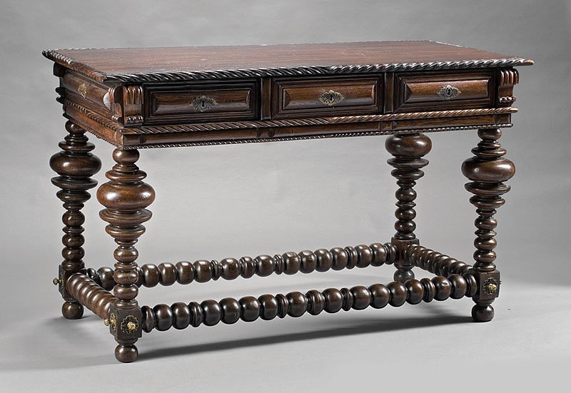 Portuguese Carved Walnut, Rosewood Refectory Table: An Antique Portuguese Carved Walnut and Rosewood Refectory Table, of Renaissance inspiration, top with rope molded edge, frieze fitted with three raised panel drawers, boldly turned legs, conforming b