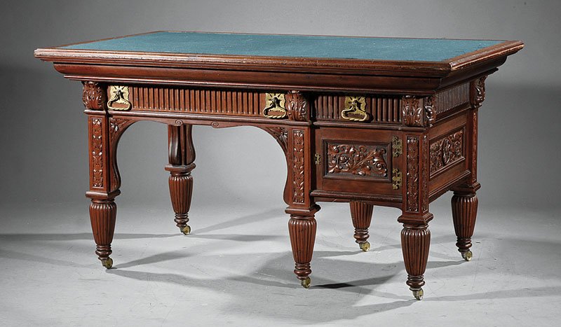 American Aesthetic Carved Mahogany Partner's Desk: A Good American Aesthetic Highly Carved Mahogany Partner's Desk, late 19th c., New York, rectangular top with inset fabric, frieze fitted with a shared long drawer and short drawer to each side, kneeh