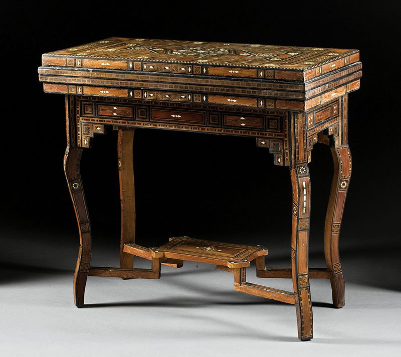 Syrian Mother-of-Pearl, Exotic Wood Games Table: An Antique Syrian Mother-of-Pearl and Exotic Woods Inlaid Games Table, c. 1920, foldover top opening to baize gaming surface and fold-out backgammon and chess board, paneled frieze, shaped legs, stret