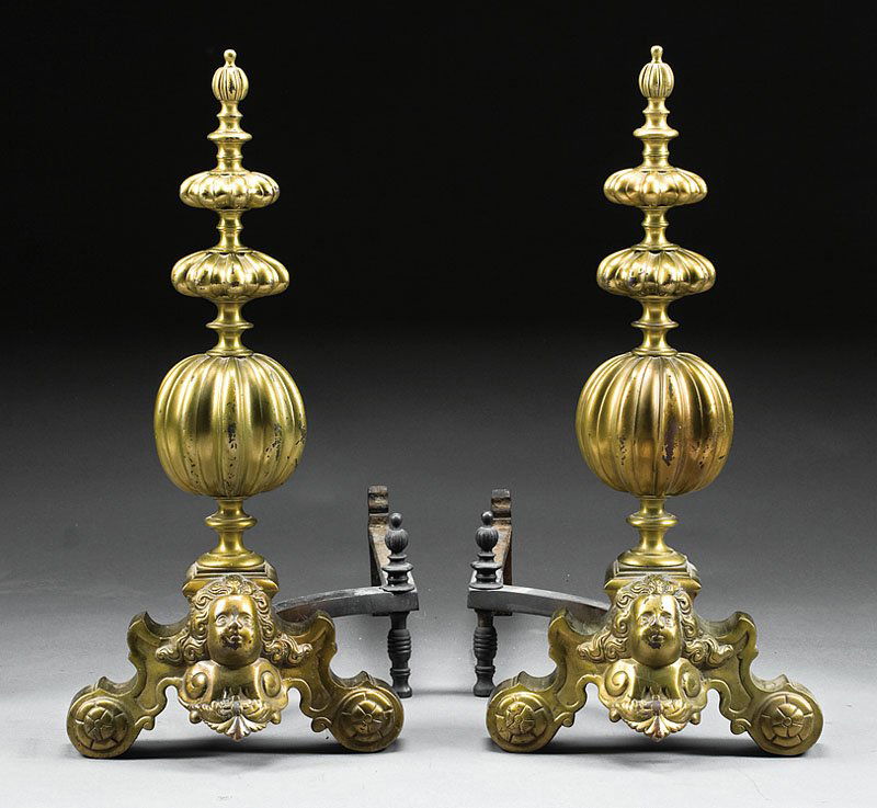 Pair of William and Mary-Style Brass Andirons: A Pair of William and Mary-Style Brass Andirons, 19th c., each standard with fluted knops and spheres, scrolled base centered by mask, iron billet bars, height 28 in., width 13 in., depth 30 in
