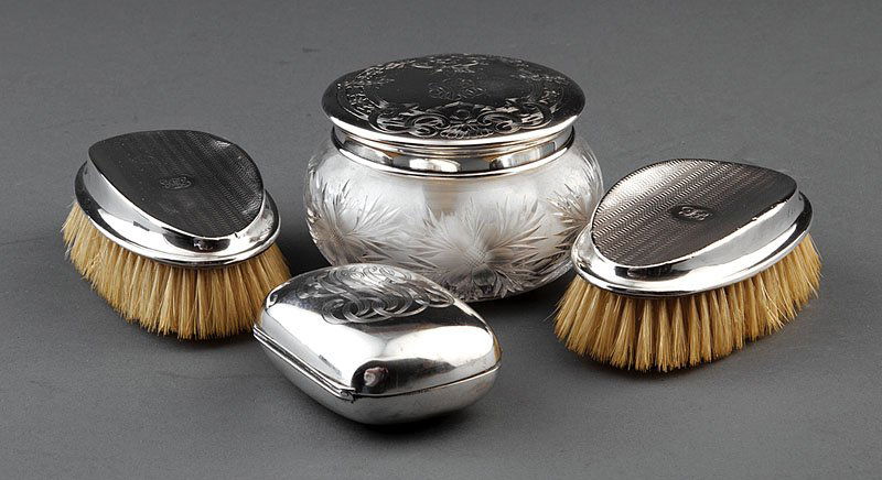 George V Sterling Silver Gentleman's Brushes: A Pair of George V Sterling Silver Gentleman's Brushes, 1925, Birmingham, each with engine-turned decoration, in fitted case; a Wallace Silversmiths sterling silver soap dish, with engraved script mon