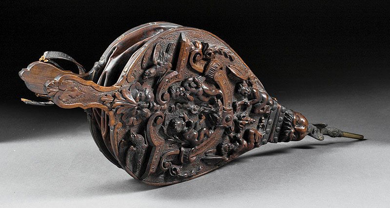 French Renaissance-Style Carved Walnut Bellows: A French Renaissance-Style Carved Walnut Bellows, 19th c., decorated with birds and putti, reverse with mask, height 27 in., width 11 in., depth 2 1/2 in
