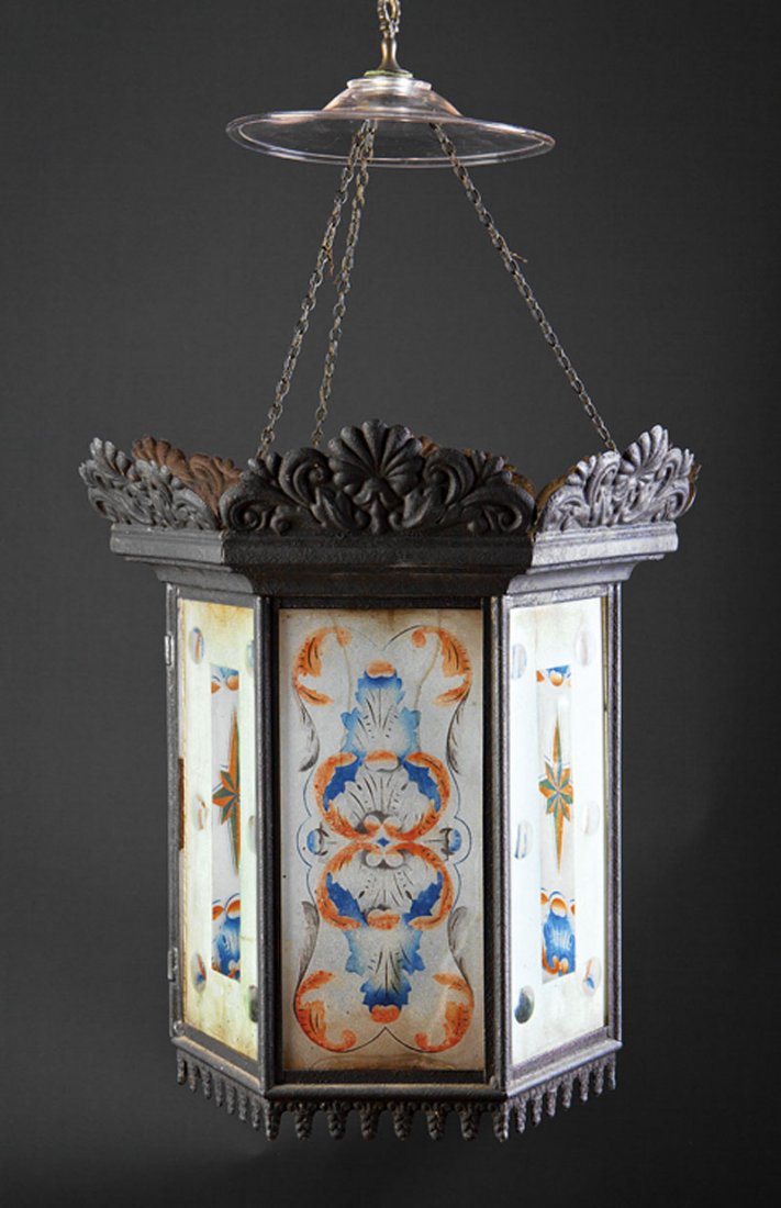 American Tole and Eglomise Hall Lantern: An American Tole and Eglomise Hall Lantern, 19th c., hexagonal form, fitted with acanthine and compass star decoration, height 24 in., diameter 9 1/2 in