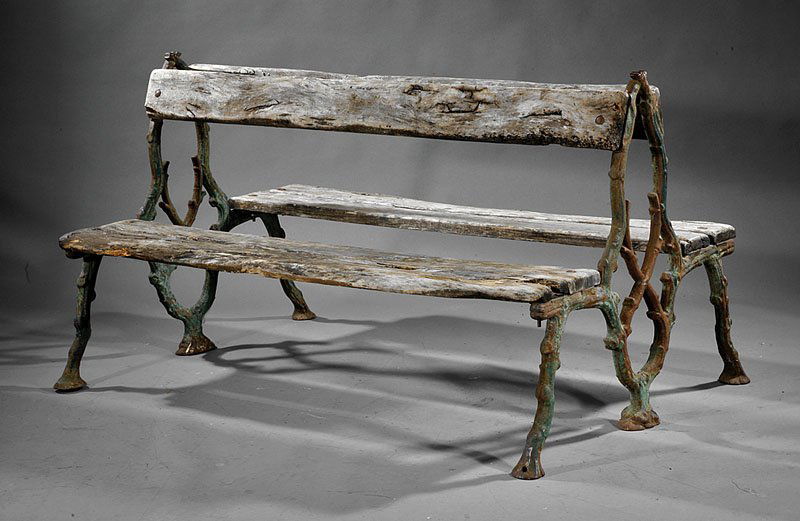 Faux Bois Cast Iron and Carved Wood Garden Bench: An Antique Faux Bois Cast Iron and Carved Wood Garden Bench, probably Italian, rustic form, opposing plank backs and seats, traces of blue paint with variable oxidation, height 34 1/2 in., width 62 in