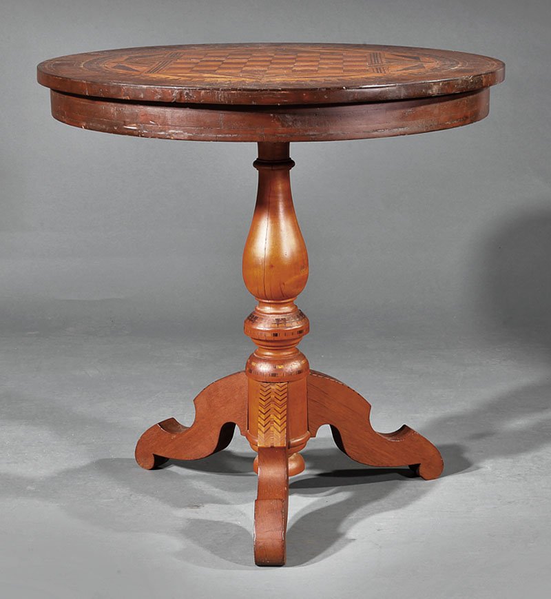 Maple, Walnut and Marquetry Tilt-Top Games Table: An American Maple, Walnut and Marquetry Tilt-Top Games Table, late 19th c., circular top inlaid with gameboard enclosed by six pointed star, geometric borders, straight frieze, baluster form standard,