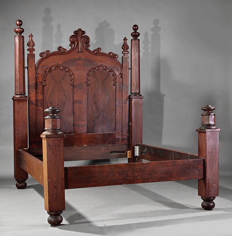 American Gothic Carved Mahogany Bedstead: An American Gothic Carved Mahogany Bedstead, mid-19th c., octagonal posts, arched headboard with gothic panels, low footboard, conforming rails, spherule feet, height 79 1/2 in., interior length 72 in