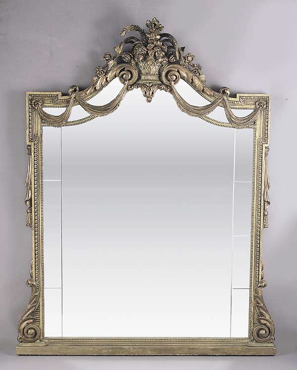 An Antique Louis XVI-Style Giltwood Pi: An Antique Louis XVI-Style Giltwood Pier Mirror , late 19th c., the scrolled pediment cresting on a basket of flowers, the engraved rectilinear mirror plate within a beaded and stiff leaf frame, heigh