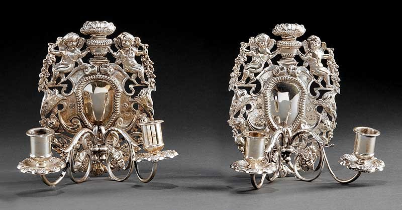 William Hutton & Sons Sterling Silver Sconces: A Pair of English Sterling Silver Sconces, in the early Georgian taste, William Hutton & Sons, Ltd., London, 1895, mark reg. 1894; height 8 in., width 6 in., weight 37.45 troy ozs