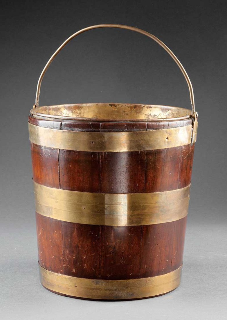 A George III Brass Bound Mahogany Bucket: A George III Brass Bound Mahogany Bucket, 18th c., removable liner, bail handle, height 12 in., diameter 12 in