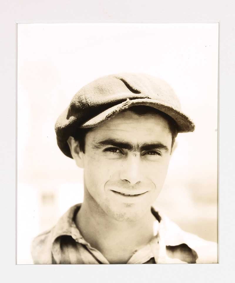 Walker Evans (American, 1903-1975): Walker Evans (American, 1903-1975), "Depression Worker", silver gelatin print, artist stamp and numbered "111-41" en verso of print and mat board, 10 in. x 8 in., unframed Provenance: Collection of Ar