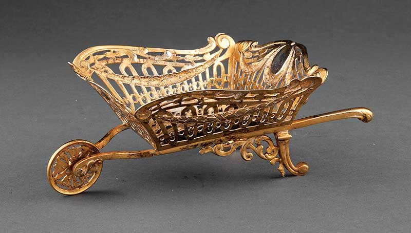 A Continental Silver Gilt Wheelbarrow Table Garni: A Continental Silver Gilt Wheelbarrow Table Garniture, Germany,.925 fine, height 3 1/2 in., length 9 1/2 in., weight 13.70 troy ozs