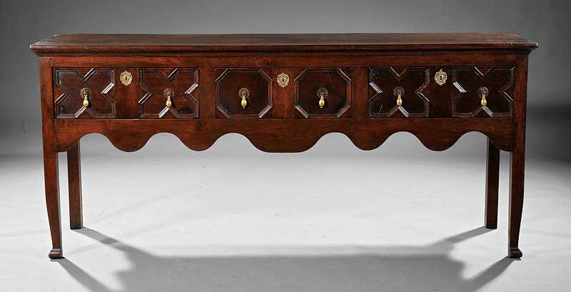 Queen Anne-Style Carved Walnut Welsh Dresser Base: An Antique Queen Anne-Style Carved Walnut Welsh Dresser Base, rectangular top, three frieze drawers, scalloped skirt, square legs, block feet, height 32 1/2 in., width 74 in., depth 19 in
