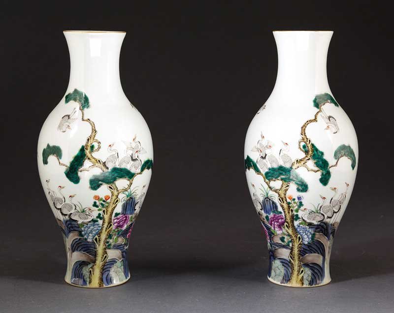Chinese Famille Rose Porcelain Olive-Form Vases: A Pair of Chinese Famille Rose Porcelain Olive-Form Vases, probably 20th c., decorated with red crested cranes amid flowering plants and pine, bases with Qianlong marks, height 12 in
