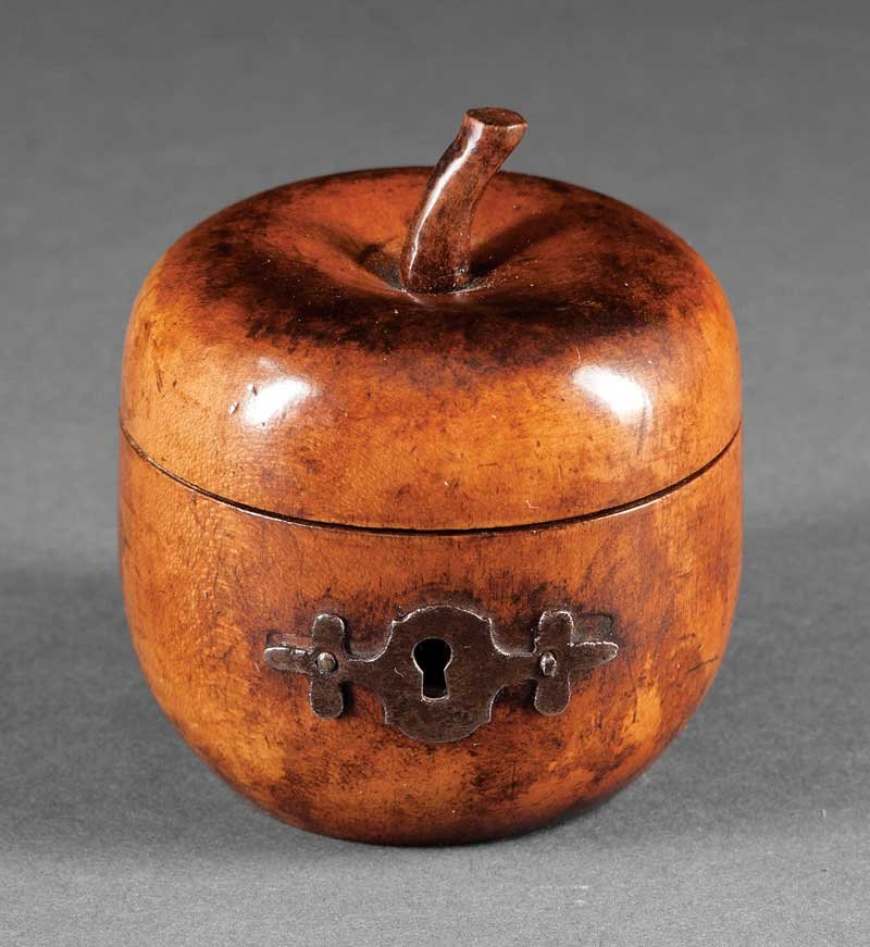An English Apple-Form Tea Caddy: An English Apple-Form Tea Caddy, 18th c., with cut steel escutcheon, interior retains traces of foil lining, height 2 3/4 in . Provenance: Purchased from Wellesley House Ltd., Lake Forest, IL