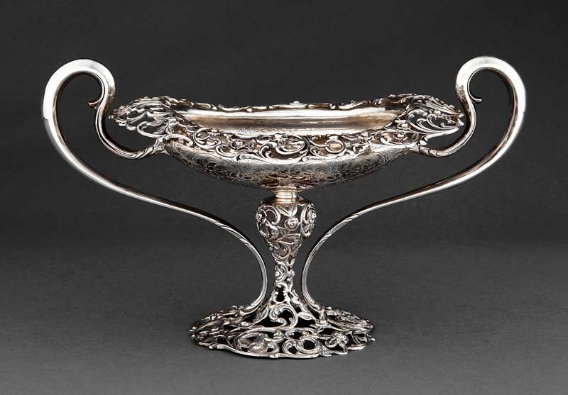 Roger Williams Sterling Silver Centerpiece: An American Sterling Silver Centerpiece, Roger Williams, Providence, RI, c. 1900-1913, oval bowl with reticulated floral scroll border, scroll handles and reticulated floral scroll pedestal foot, heig