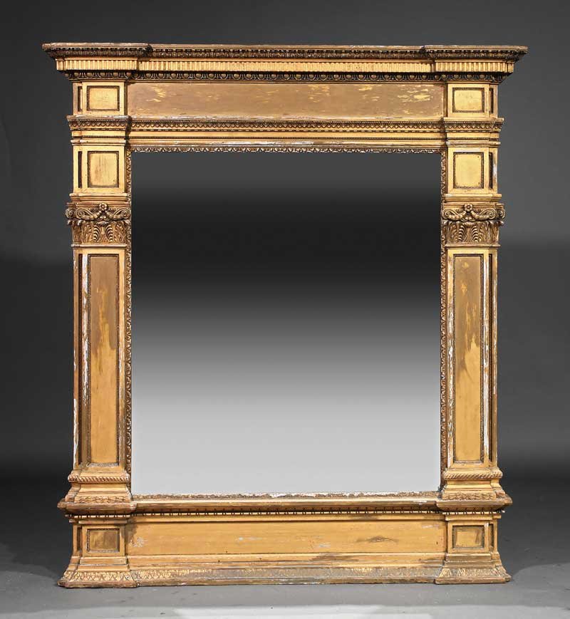 Empire Carved and Gilded Overmantel Mirror: A Monumental Empire Carved and Gilded Overmantel Mirror, of architectonic form, blocked molded cornice, conforming frieze, mirror plate flanked by pilasters, conforming base, height 71 in., width 64 i