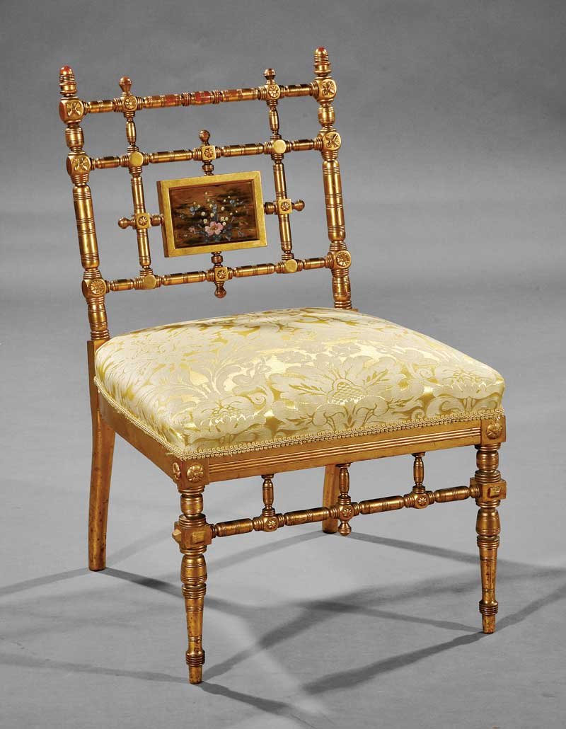 American Aesthetic Carved and Gilt Slipper Chairs: An American Aesthetic Carved and Gilt Slipper Chair, late 19th c., turned spindled back with painted panel, conforming seat rail, turned tapered legs