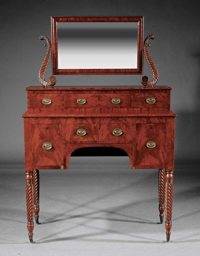 Classical Carved Mahogany Dressing Table: An American Classical Carved Mahogany Dressing Table, early 19th c., New York, rectangular mirror on scrolled supports, superstructure with three drawers, lower case with kneehole configuration of dra