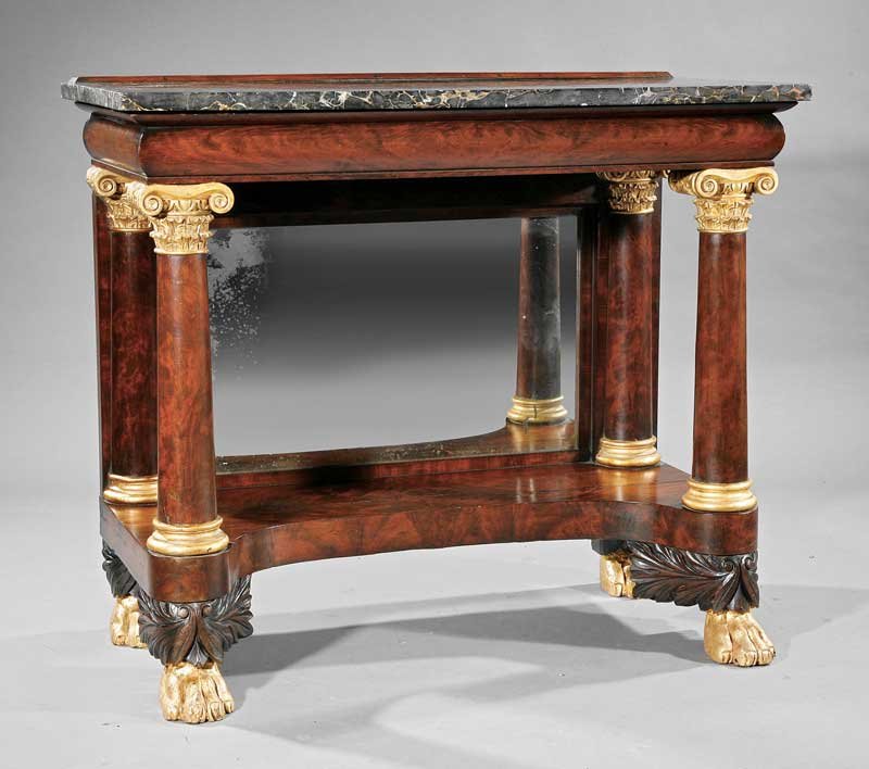 Carved Mahogany and Parcel Gilt Pier Table: An American Classical-Style Carved Mahogany and Parcel Gilt Pier Table, late 19th/early 20th c., in the New York style, marble top, torus-molded frieze, columnar supports with composite capitals, mirr