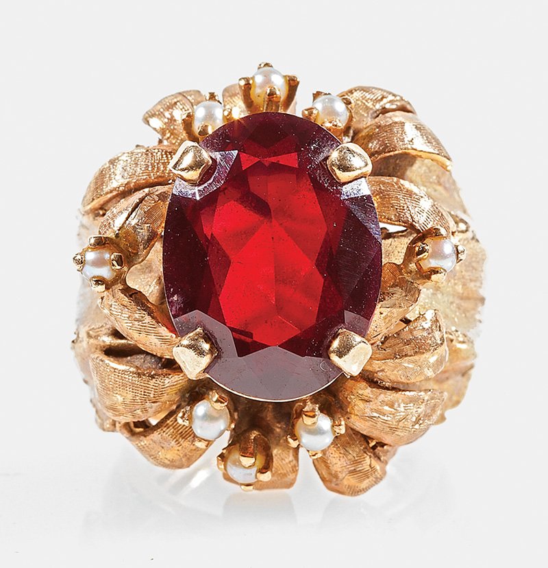 A 14 kt. Yellow Gold, Garnet and Pearl Ring: A 14 kt. Yellow Gold, Garnet and Pearl Ring, set with a large oval faceted garnet and 8 small pearls, weight 13 dwts