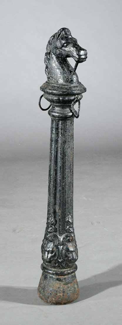 Cast Iron Horsehead Hitching Post poss. Fiske: An American Cast Iron Horsehead Hitching Post, 19th c., possibly J.W. Fiske & Co., New York, tapered fluted post with hitching rings, lion's masks below, height 41 in