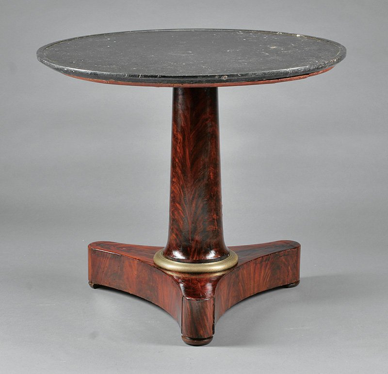 Charles X Mahogany Gilt Bronze-Mounted Gueridon: A Charles X Mahogany and Gilt Bronze-Mounted Gueridon, early 19th c., dished Gris de Ste. Anne marble top, columnar support, incurvate triangular plinth, height 28 in., diameter 32 in