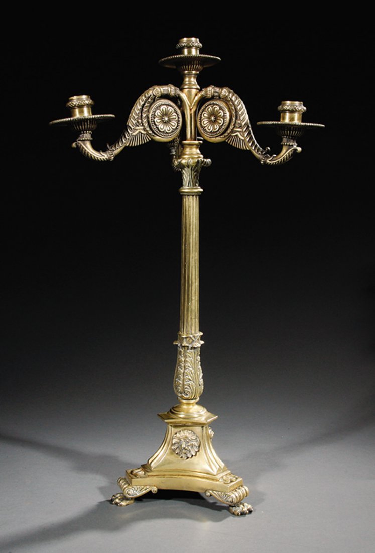 A Regency Gilt Bronze Four-Light Candelabrum: A Fine Regency Gilt Bronze Four-Light Candelabrum, early 19th c., in the manner of William Bullock, scrolled branches, with rosettes, fluted standard, incurvate triangular base, volute terminals, paw 