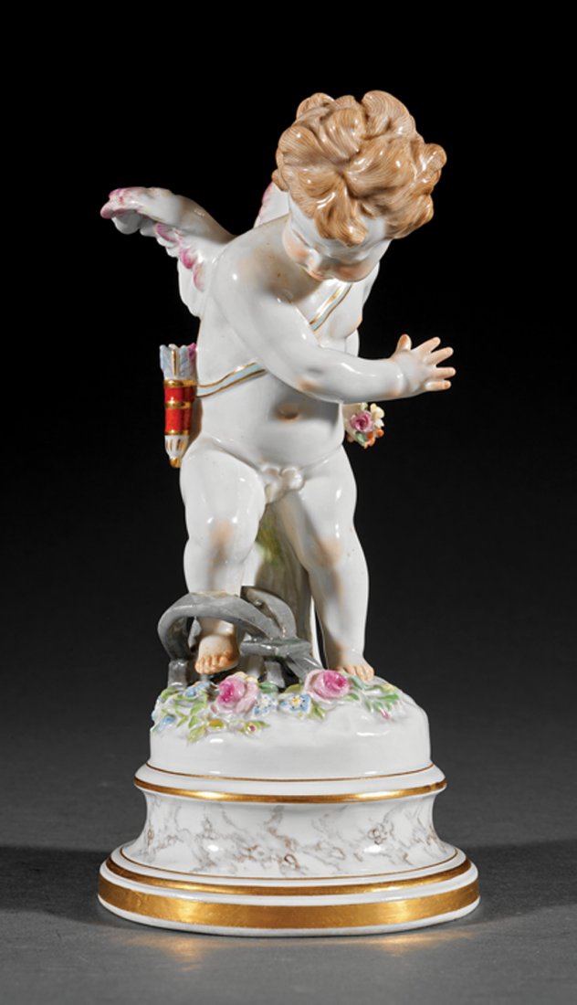 A "Meissen" Porcelain Figure of Cupid: A "Meissen" Porcelain Figure of Cupid Caught in a Trap, late 19th/early 20th c., crossed-swords mark, incised "L.120", height 8 in. Provenance: "Villa Rose" Collection of Grace Collins Lindblom, Orlan