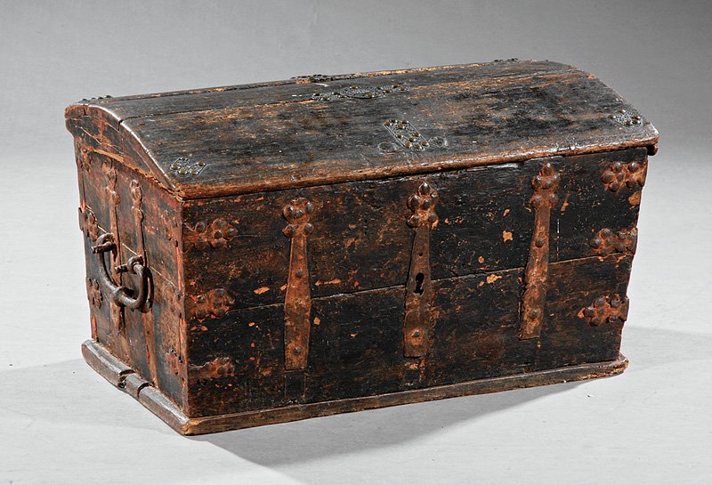 An Early Wrought Iron and Oak Chest: An Early Wrought Iron and Oak Chest, probably 18th c., domical lid with strap hinges, void interior, carrying handles, height 15 in., width 27 in., depth 17 in. Provenance: Estate of James Fenimore Co