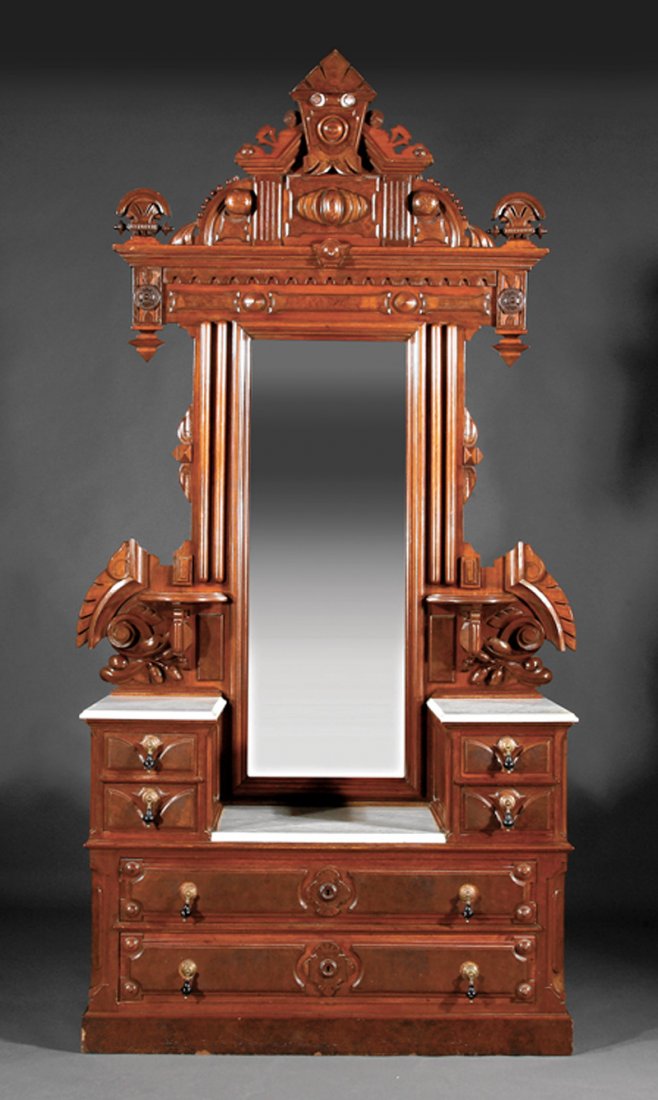 Buckley & Bancrof Walnut Bedroom Suite: An American Renaissance Carved and Burled Walnut Bedroom Suite, late 19th c., labeled "Buckley & Bancroft, Boston", comprising a bedstead, mirror-backed dressing chest and two bedside commodes, bedste