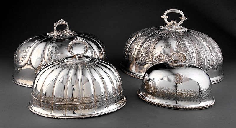 Four English Silverplate Meat Domes: Four Antique English Silverplate Meat Domes, embossed scrolling foliage and flowers on the shaped sides of the two larger domes and bright-cut engraved bands on the two smaller ones, all with removabl