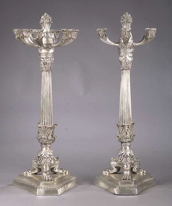 A Pair of Monumental Empire-Style Silv: A Pair of Monumental Empire-Style Silvered Bronze or Brass Six-Light Candelabra , 20th c., each foliate branch connected to a finialed, acanthus and reeded tapering shaft with trifed paw feet on an in